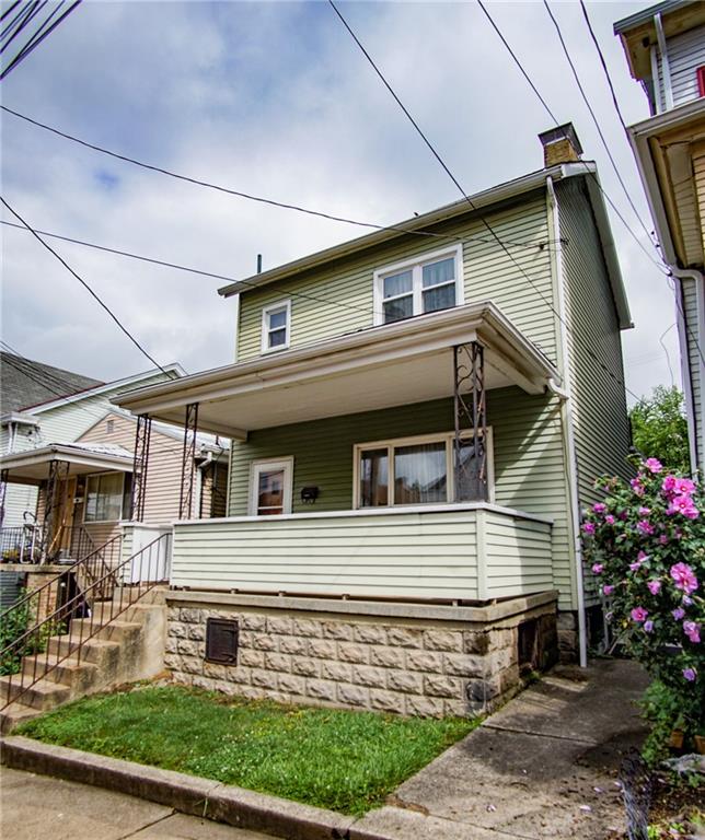 908 2nd Street McKees Rocks, PA 15136 - Photo 1 of 13 a front view of a house with garden