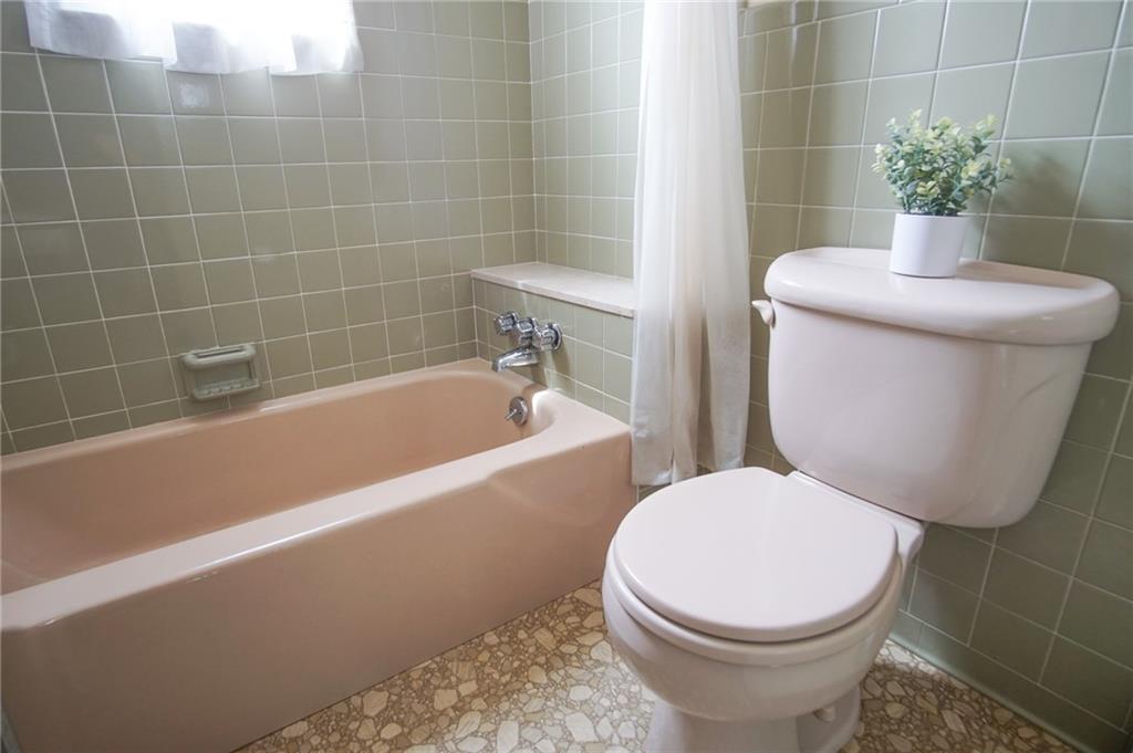 908 2nd Street McKees Rocks, PA 15136 - Photo 12 of 13 a white toilet sitting next to a bath tub