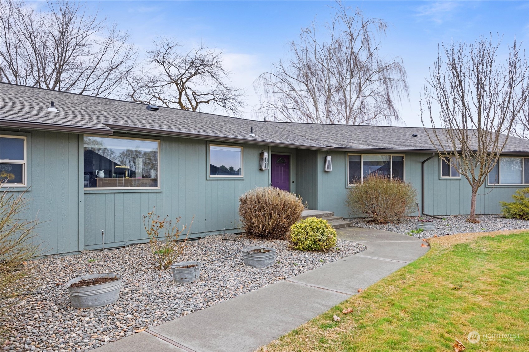 223 Hanson Road Touchet, WA 99360 - Photo 1 of 38 a front view of a house with garden