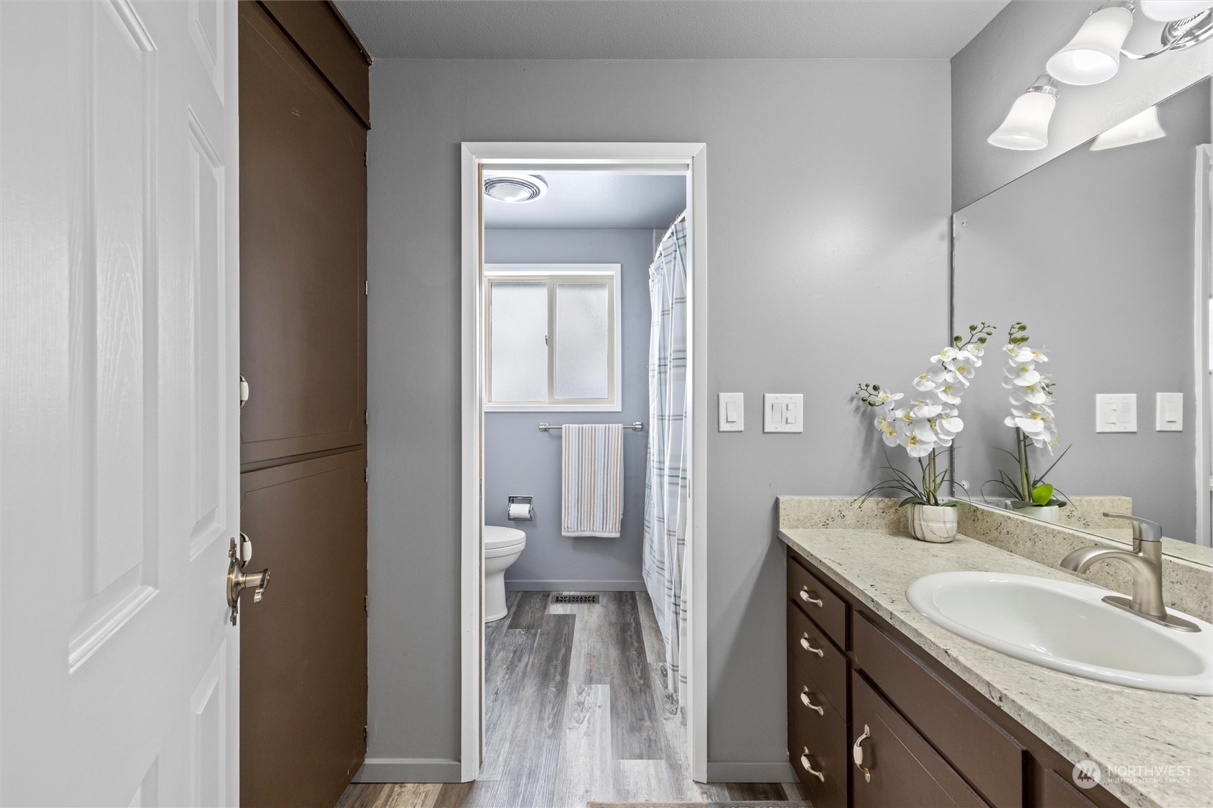 223 Hanson Road Touchet, WA 99360 - Photo 21 of 38 a bathroom with a granite countertop sink a toilet and a mirror
