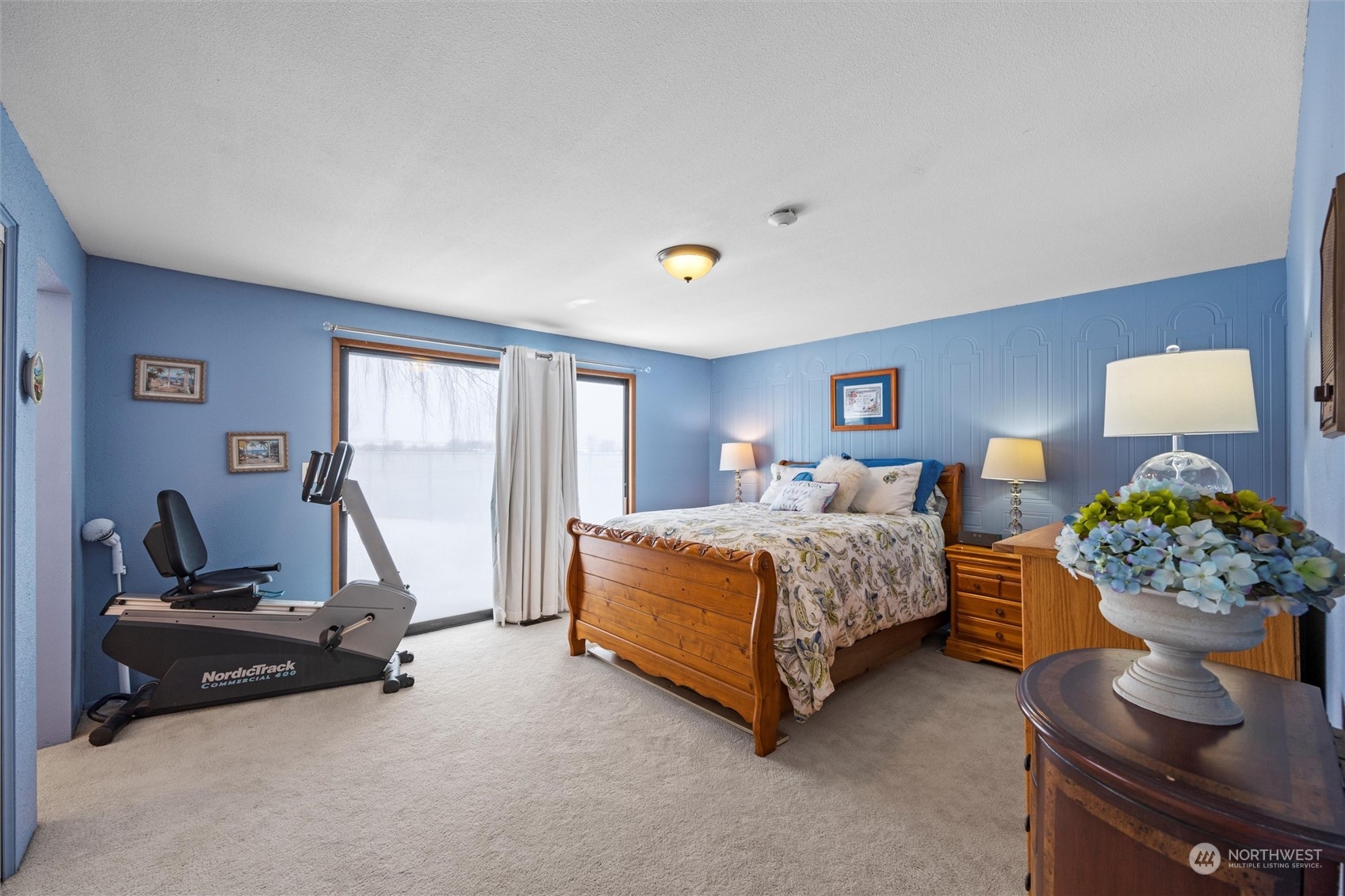 223 Hanson Road Touchet, WA 99360 - Photo 22 of 38 a bedroom with bed and a chandelier