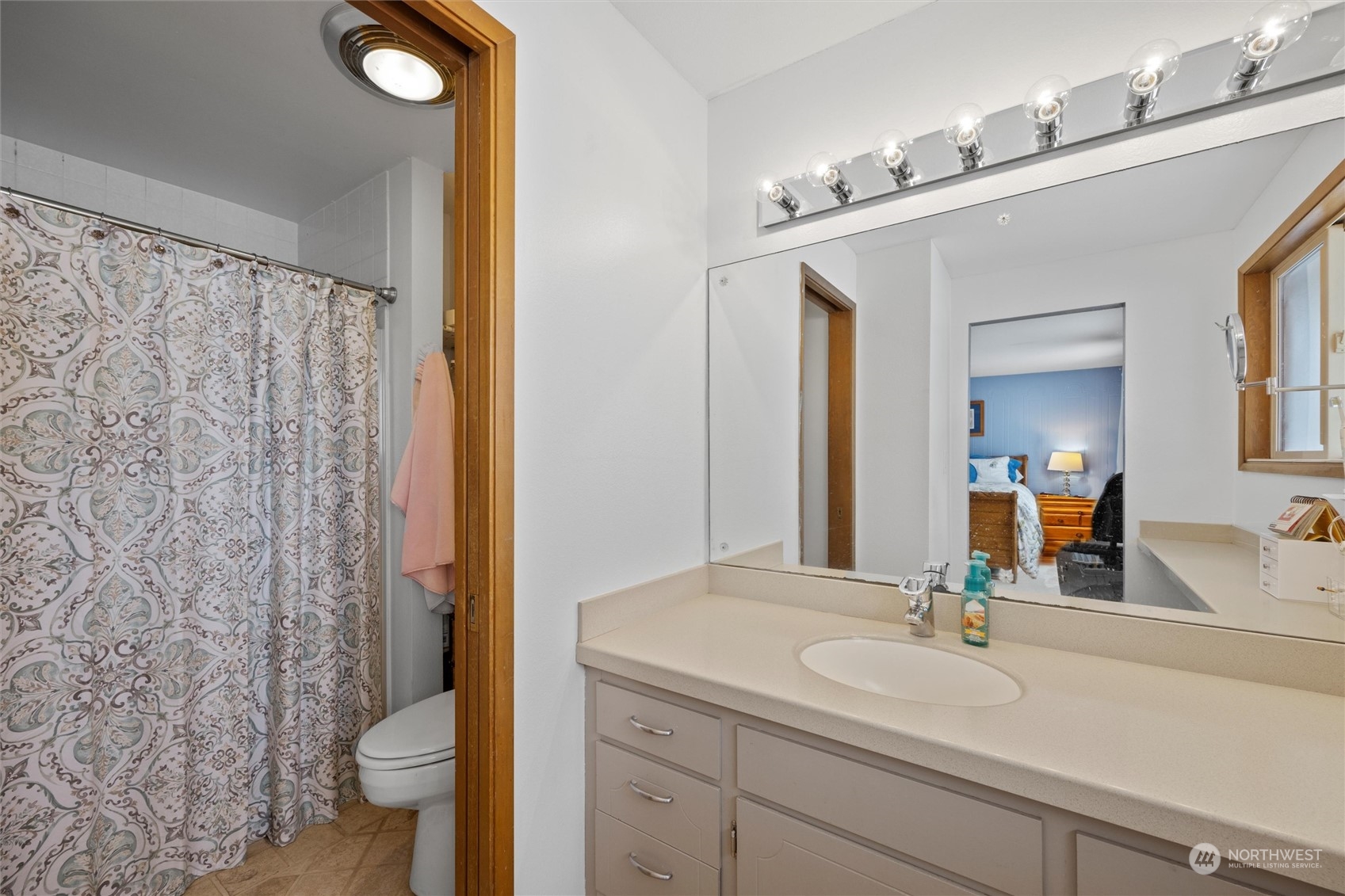 223 Hanson Road Touchet, WA 99360 - Photo 24 of 38 a bathroom with a granite countertop sink a toilet and a mirror