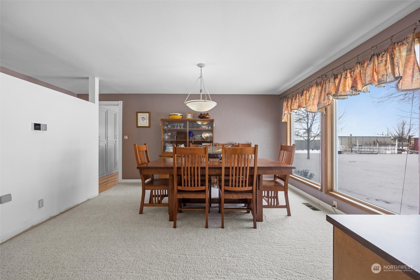 223 Hanson Road Touchet, WA 99360 - Photo 9 of 38 a view of a dining room with furniture and chandelier