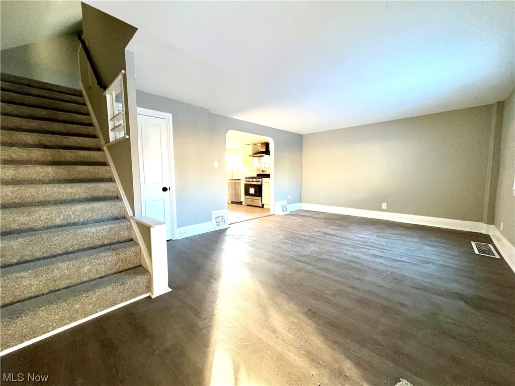 3527 Broadview Road Cleveland, OH 44109 - Photo 13 of 29 Unfurnished living room with dark hardwood / wood-style floors