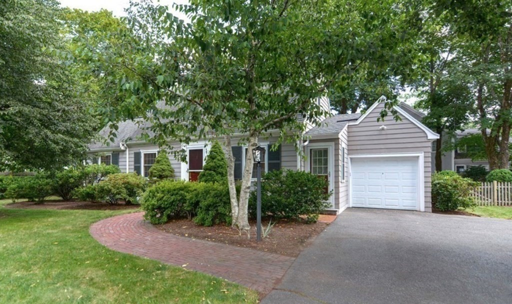 2 Shirley Road Wellesley, MA 02482 - Photo 1 of 32 a front view of a house with a yard and garage