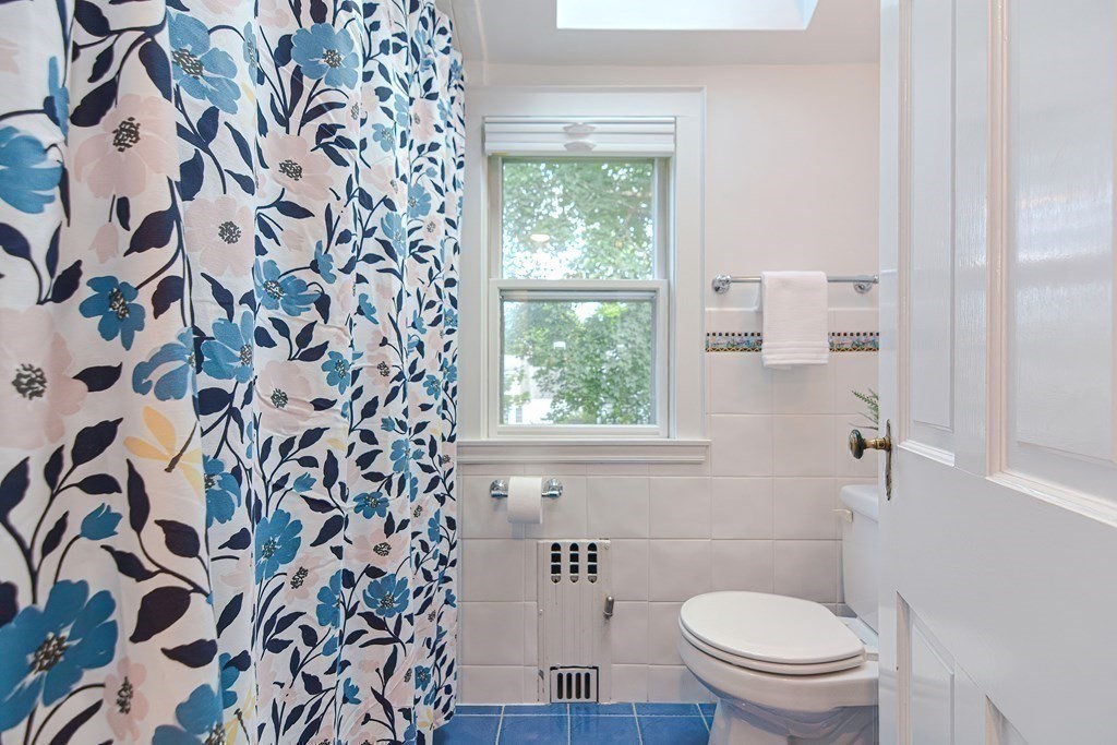 2 Shirley Road Wellesley, MA 02482 - Photo 26 of 32 a bathroom with a toilet and a shower curtain