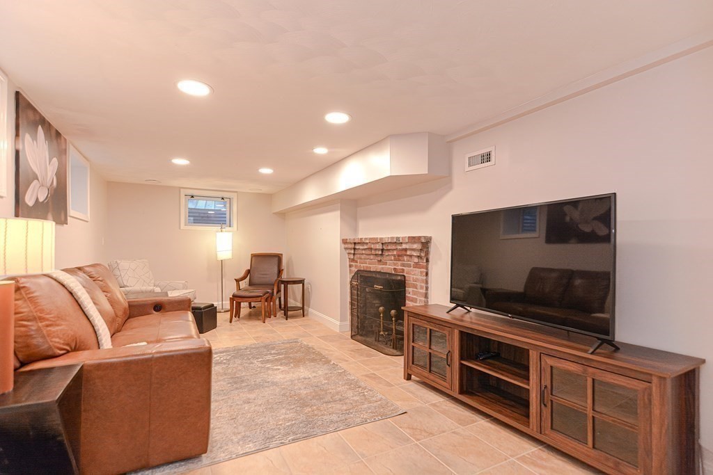 2 Shirley Road Wellesley, MA 02482 - Photo 27 of 32 a living room with furniture and a flat screen tv