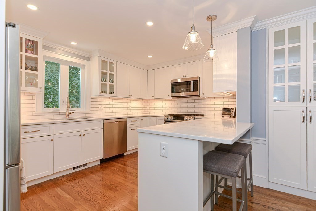 2 Shirley Road Wellesley, MA 02482 - Photo 7 of 32 a kitchen with appliances a sink and cabinets