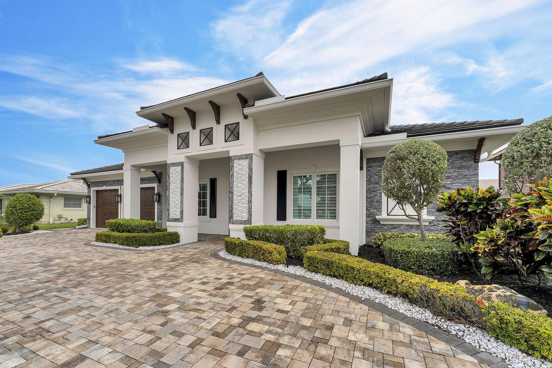 847 Forsyth Street Boca Raton, FL 33487 - Photo 1 of 40 a front view of a house with garden