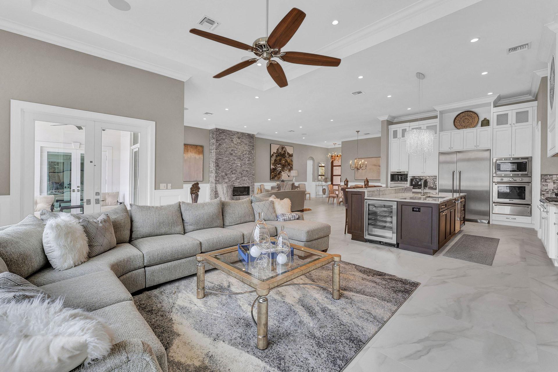 847 Forsyth Street Boca Raton, FL 33487 - Photo 8 of 40 a living room with furniture kitchen view and a chandelier