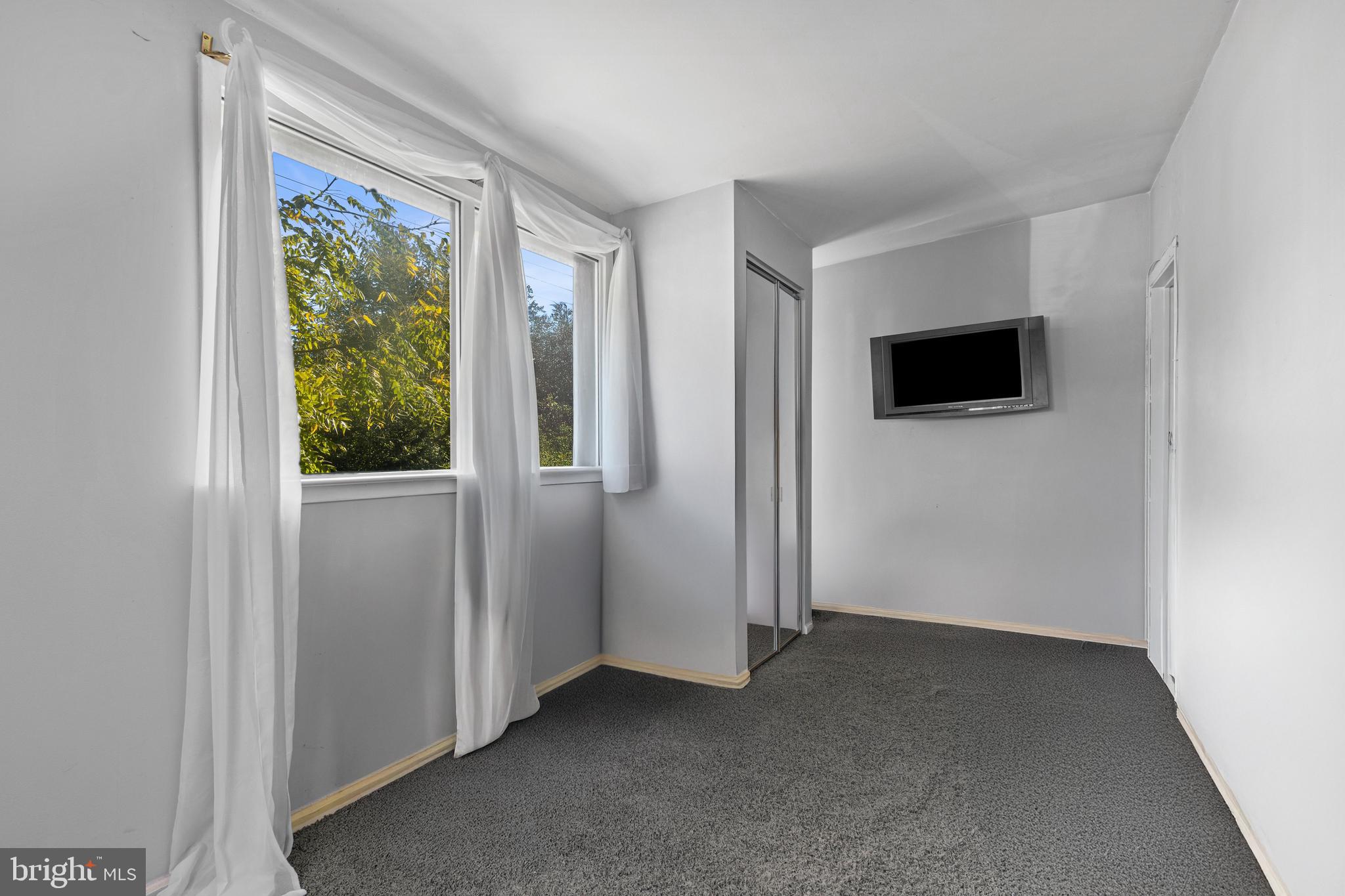 2606 Springfield Road Broomall, PA 19008 - Photo 24 of 32 a view of a livingroom with an empty space and a window