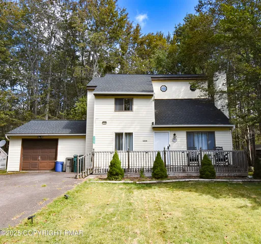 a front view of a house with swimming pool