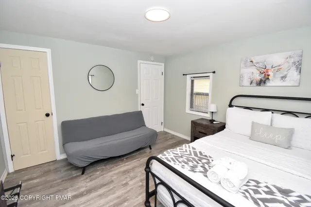 a kitchen with kitchen island granite countertop a sink cabinets and stainless steel appliances