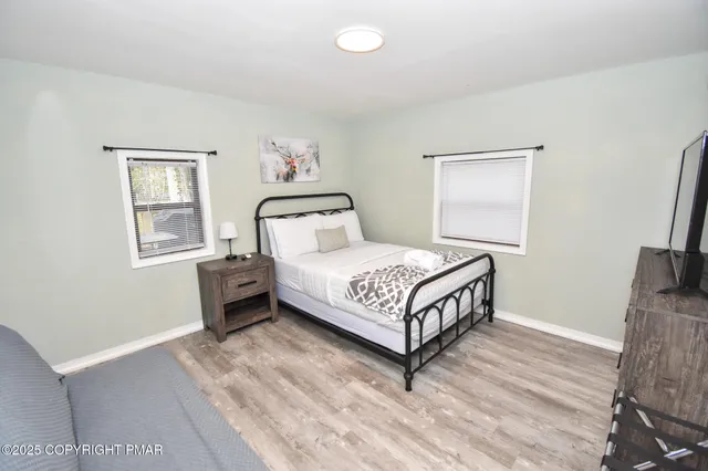 a kitchen with kitchen island granite countertop a sink stove and refrigerator