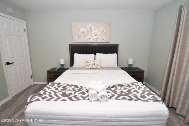 a bathroom with a sink mirror vanity and toilet