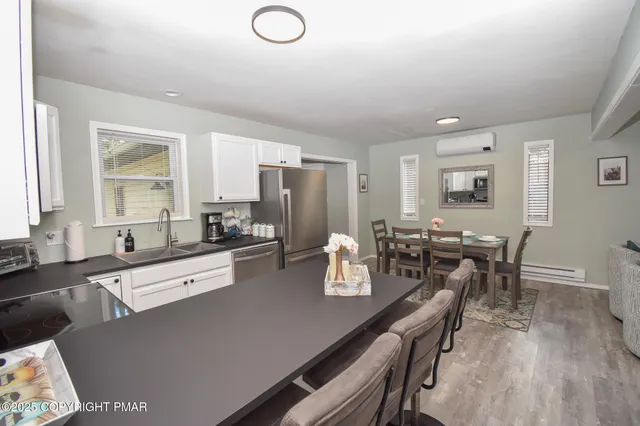a view of bathroom with a sink and a mirror
