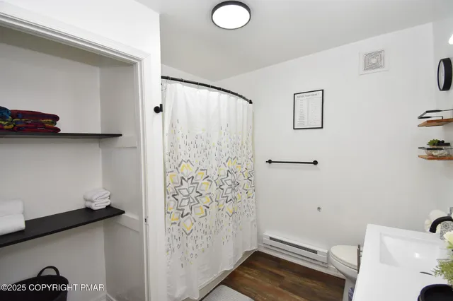 a bathroom with a sink a mirror and a shower