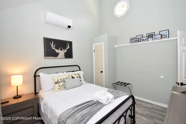 a bedroom with bed and a window