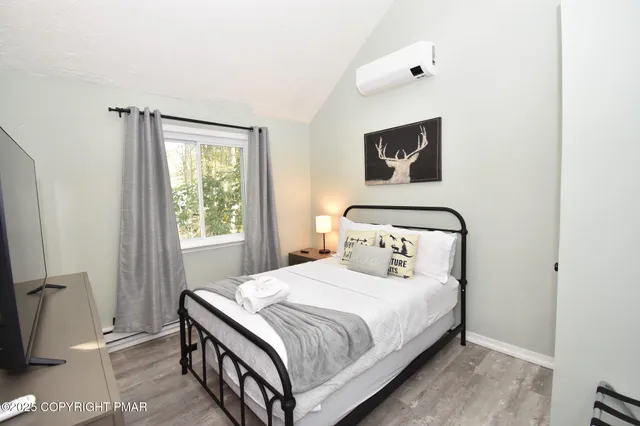 a bedroom with bed and a night stand