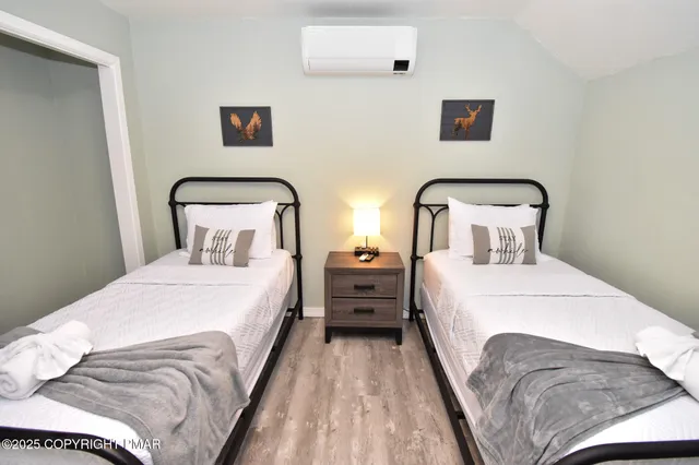 a bedroom with a bed and a night stand