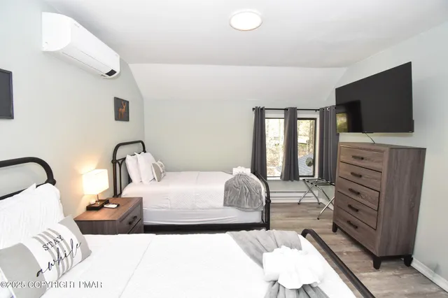 a bedroom with a bed and a mirror