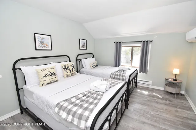 a bedroom with furniture and a window