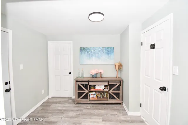 a bedroom with a bed and tv