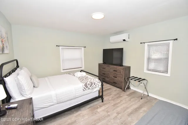 a bedroom with a bed and a couch