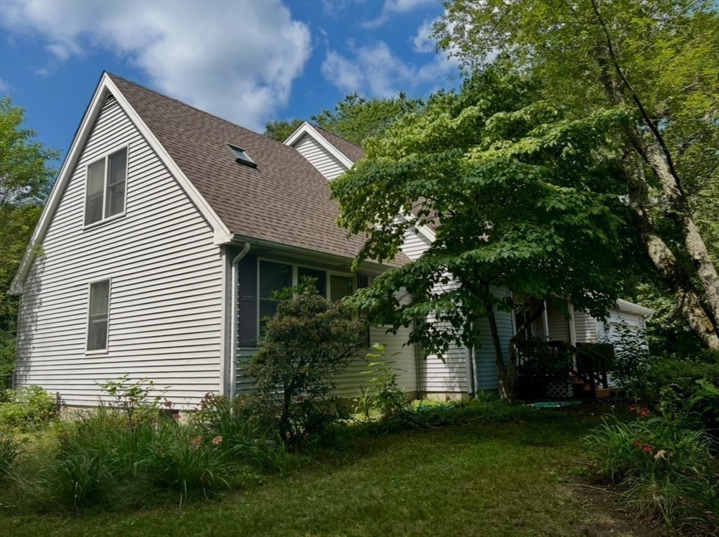 178 South Worcester Street Norton, MA 02766 - Photo 5 of 26 a front view of a house with a garden