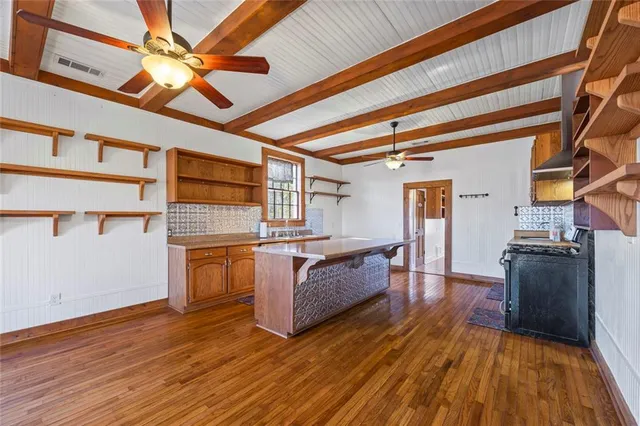 a kitchen with sink and refrigerator