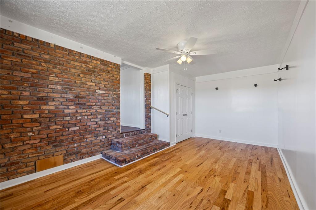 102 Mt Moriah Road Auburn, GA 30011 - Photo 22 of 44 a bedroom with a bed and a ceiling fan
