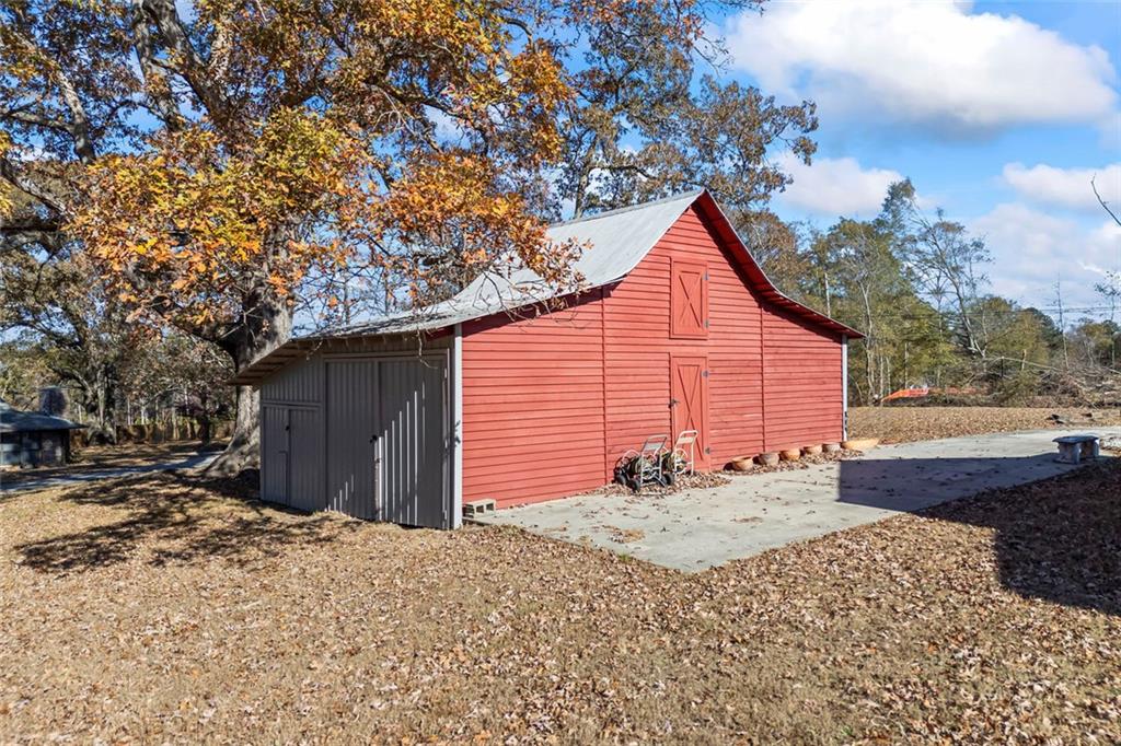 102 Mt Moriah Road Auburn, GA 30011 - Photo 25 of 44 a backyard of a house with a yard and garage