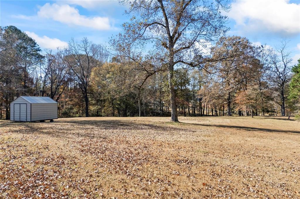 102 Mt Moriah Road Auburn, GA 30011 - Photo 27 of 44 a view of a yard with trees