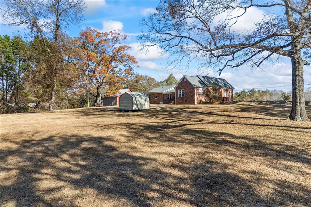 102 Mt Moriah Road Auburn, GA 30011 - Photo 29 of 44 a view of a road with large trees
