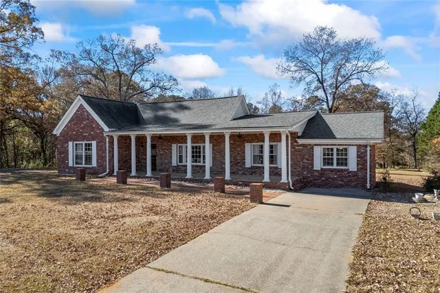 front view of a house with a yard