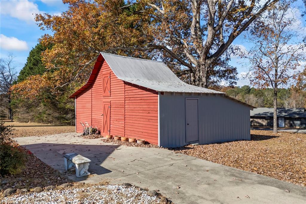 102 Mt Moriah Road Auburn, GA 30011 - Photo 31 of 44 a view of a backyard with large trees