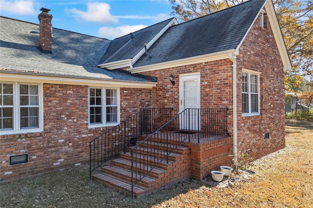 102 Mt Moriah Road Auburn, GA 30011 - Photo 34 of 44 a view of a brick house with many windows