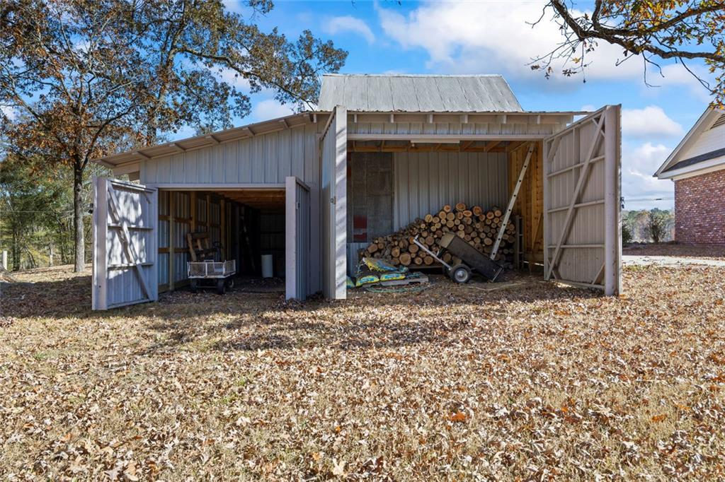 102 Mt Moriah Road Auburn, GA 30011 - Photo 38 of 44 a view of a house with a patio and a yard