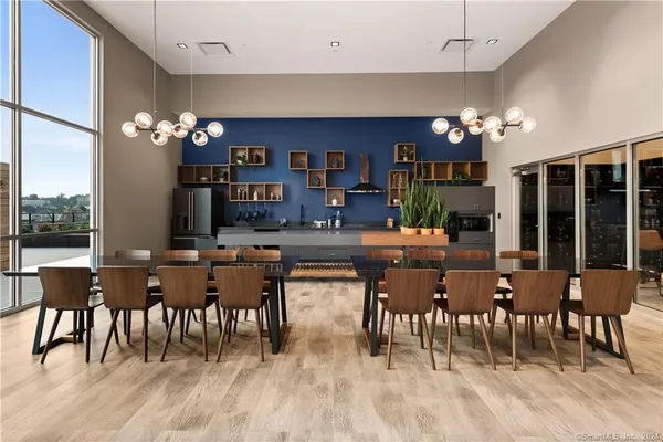 a dining hall with furniture window and wooden floor