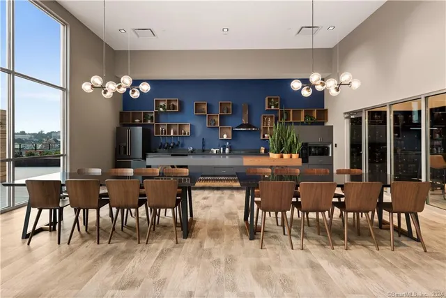 a dining hall with furniture window and wooden floor