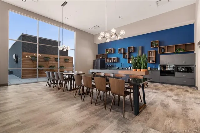 a view of a dining room with furniture window and wooden floor