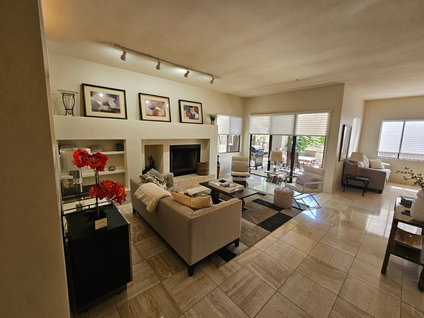7700 East Gainey Ranch Road, Unit 153 Scottsdale, AZ 85258 - Photo 10 of 24 a living room with furniture and a flat screen tv