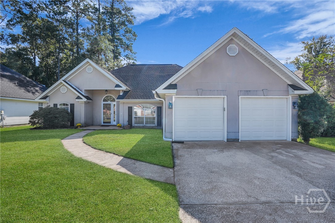 17 Mallorys Way Savannah, GA 31419 - Photo 1 of 41 Front of home with light exterior and big driveway