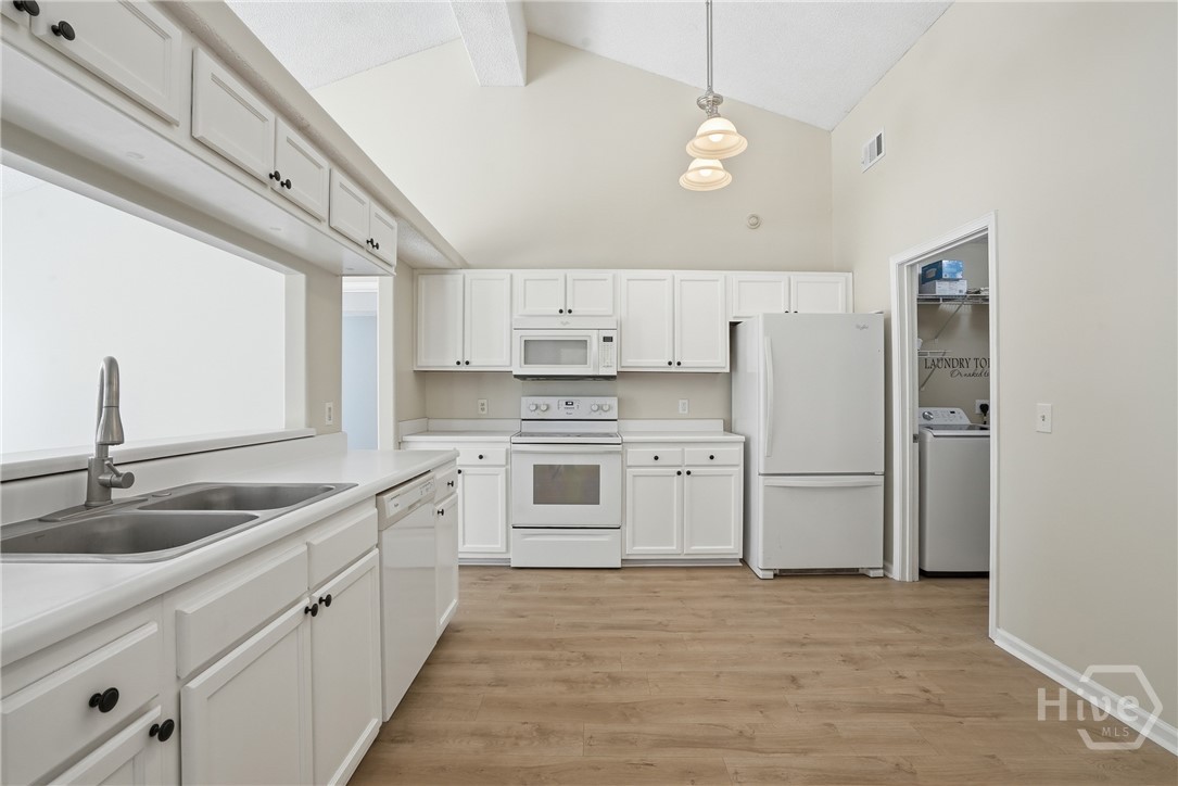 17 Mallorys Way Savannah, GA 31419 - Photo 2 of 41 Kitchen with white cabinets and white appliances