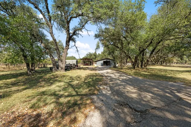 a living room with furniture kitchen view and a dining table