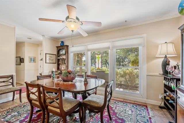 a large white kitchen with a stove and a sink