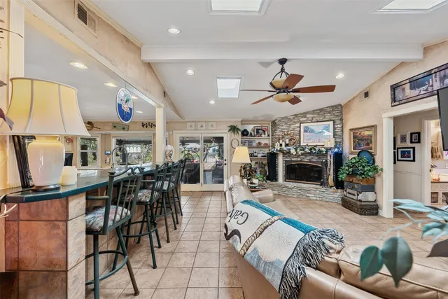a kitchen with a sink a refrigerator and microwave