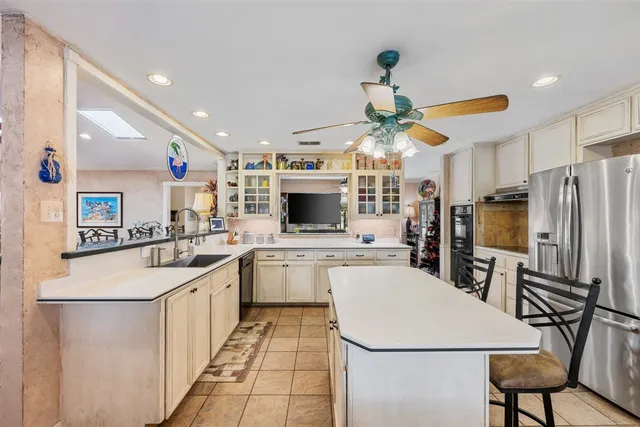 a kitchen with cabinets and window