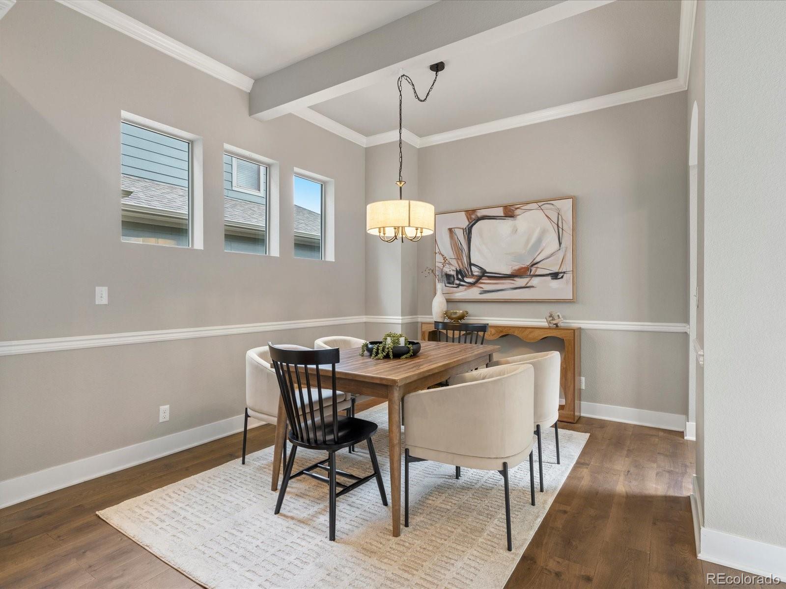 5468 Uinta Way Denver, CO 80238 - Photo 11 of 44 a view of a dining room with furniture and wooden floor