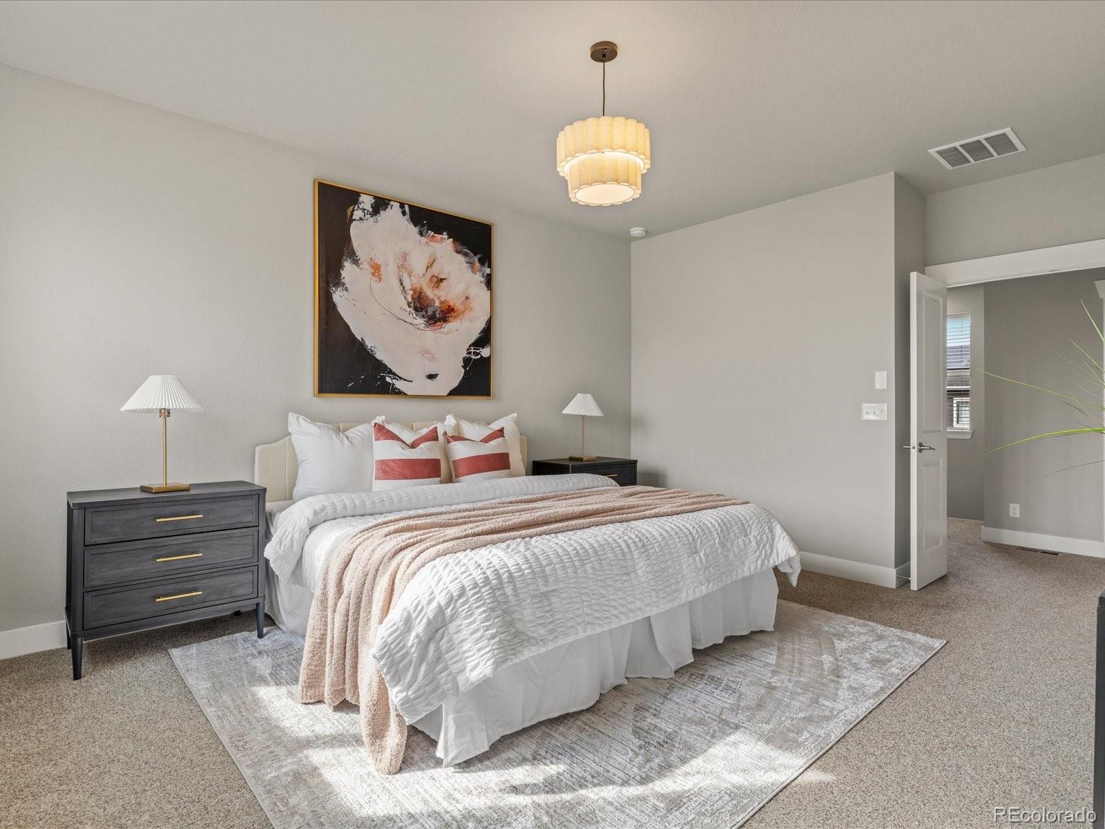 5468 Uinta Way Denver, CO 80238 - Photo 17 of 44 a bedroom with bed and window